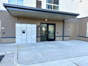 Main Entry and package lockers at All Saints Apartments, DENVER